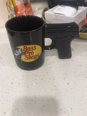 Bass Pro Shops Black Mug with Yellow Logo and Gun Handle
